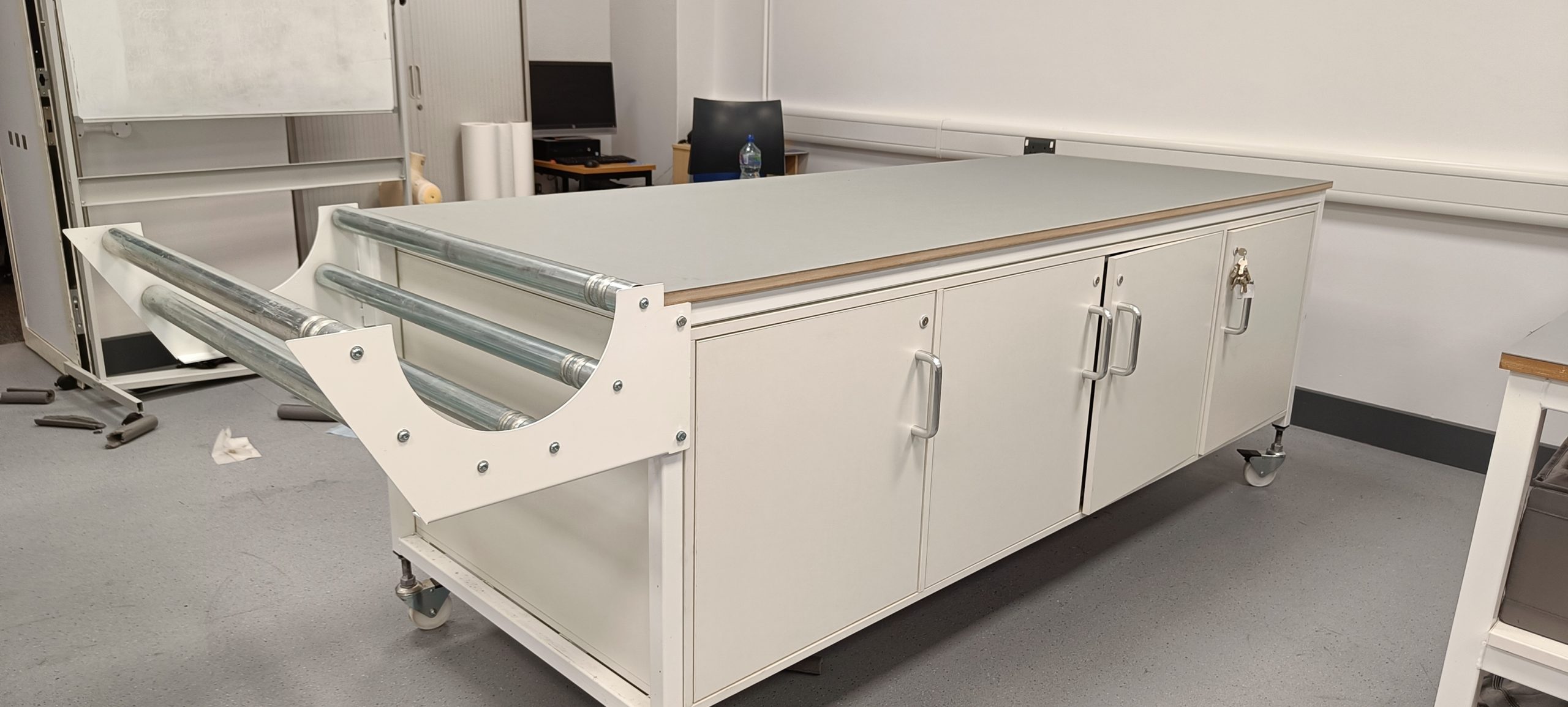 cutting table with storage and fabric trough
